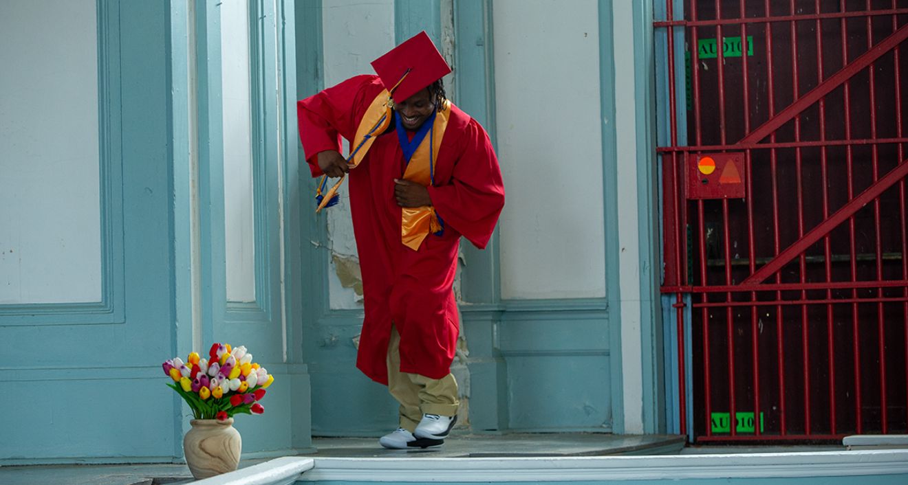 Andrew “Duke” Dickson ’24 dances after receiving his diploma at the Center for Prison Education’s graduation ceremony. (©2024 Bob Handelman)